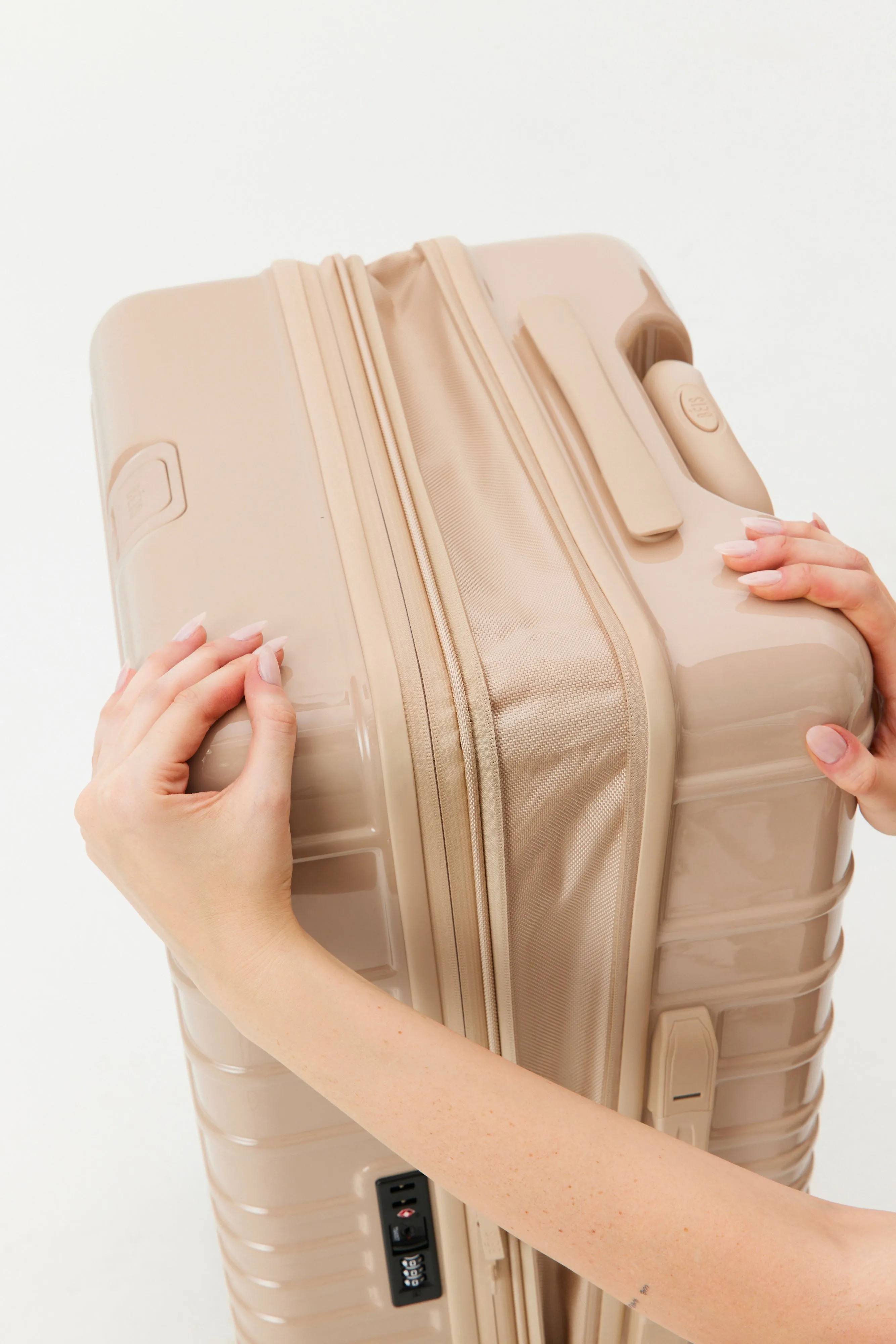 The Carry-On Roller in Glossy Beige